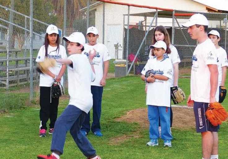 Jews and arab kids playing baseball together